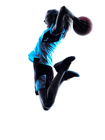 one  caucasian woman basketball player dribbling in silhouette isolated white background