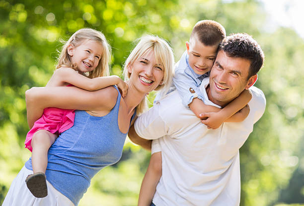 istock Happy family having fun while piggybacking in nature. 479532790