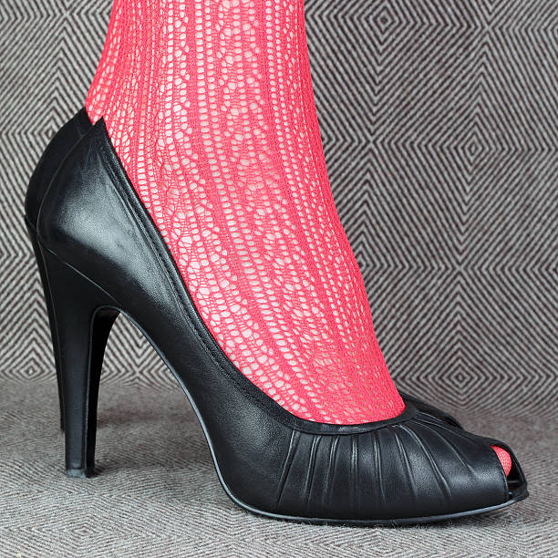 istock women's black leather shoes with red delicate tights 479532844