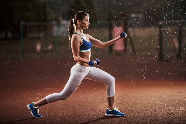 istock Athletic woman having weight training on a rain. 479533548