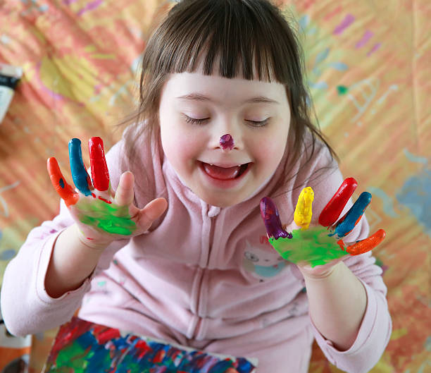 istock little girl with painted hands 479533780