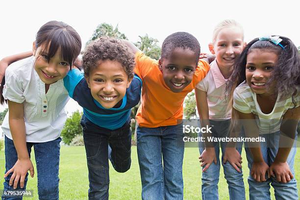 Happy Friends Playing In The Park Stock Photo - Download Image Now - Child, African-American Ethnicity, Black Color