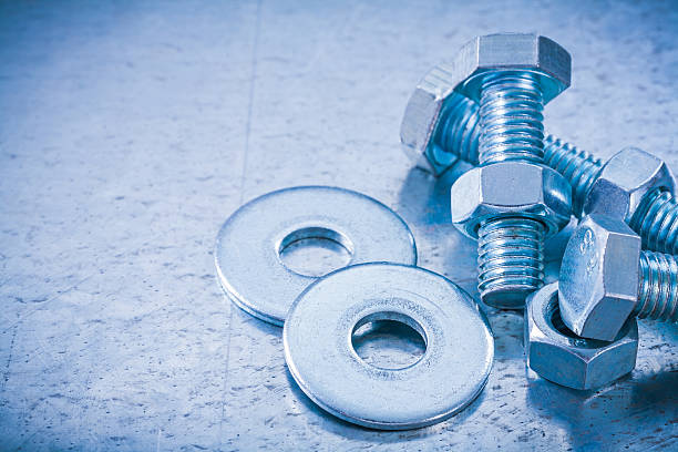 istock Stainless screwbolts nuts and bolt washers on metallic backgroun 479536044