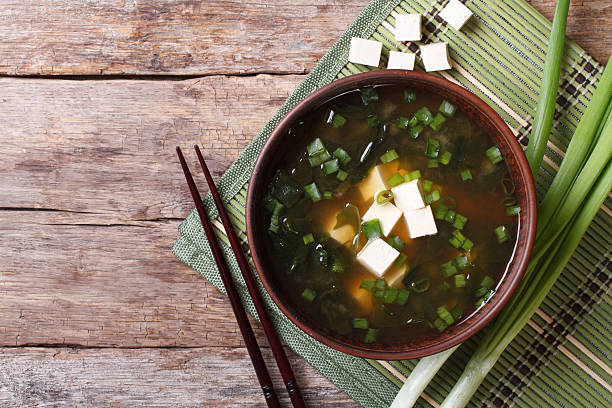 istock Japanese miso soup in a brown bowl horizontal top view 479538090