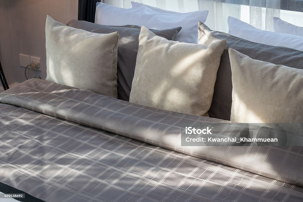 modern bedroom with brown pillows 2015 Stock Photo