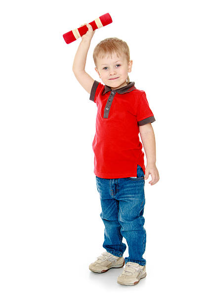 istock The blond boy holding a dumbbell 479541448