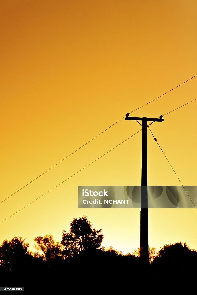 Powerpole at sunset Cable Stock Photo