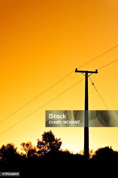Powerpole At Sunset Stock Photo - Download Image Now - Cable, Electricity Pylon, Fuel and Power Generation