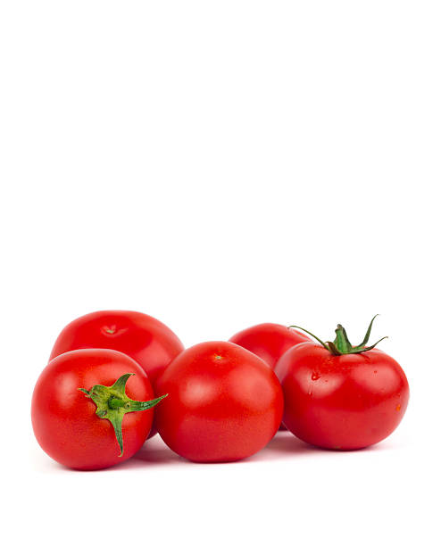 istock Fresh tomatoes with green leaves isolated on white background 479549632