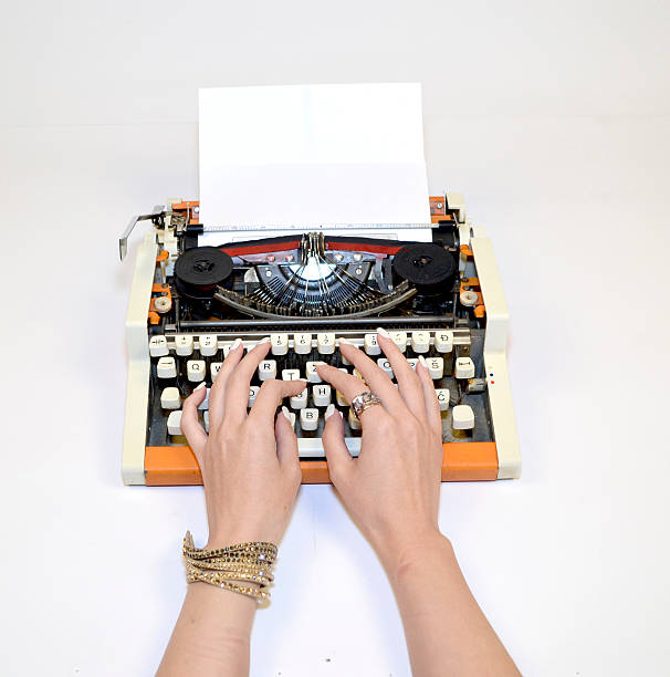 istock hand girls on a typewriter 479549912