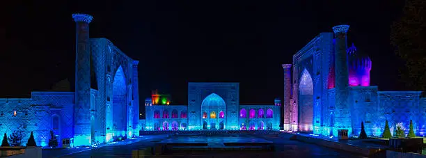 The three medrassahs of the Registan in the Silk Road city of Samarkand illuminated at night. To the left, Ulegbek Medressah; center, Tilla-Kari Medressah; right, Lion Medressah