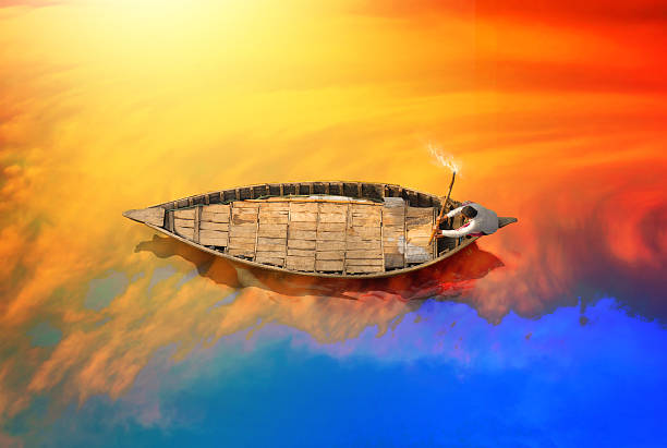 Boat in Bangladesh river Showing a Boatman riding the boat during sunset in Padma river in Bangladesh.  bangladesh photos stock pictures, royalty-free photos & images