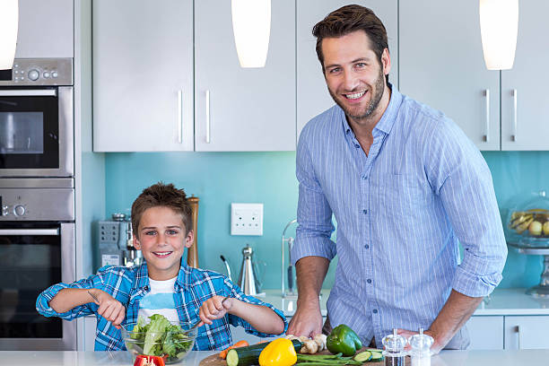 istock Happy family preparing lunch together 479550442