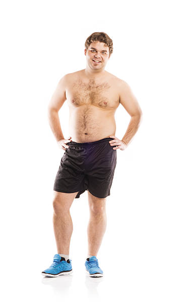 Fat fitness man Fat young man is posing in studio on white background. fat guy no shirt stock pictures, royalty-free photos & images