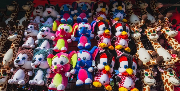 Colorful stuffed animals are prizes at games of chance on the midway.