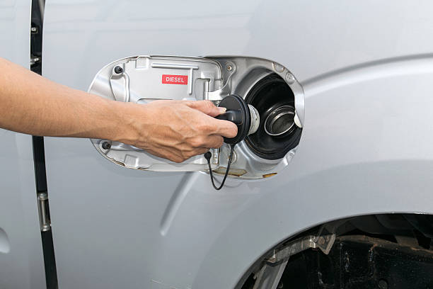istock Hand opening the oil filler cap 479556664
