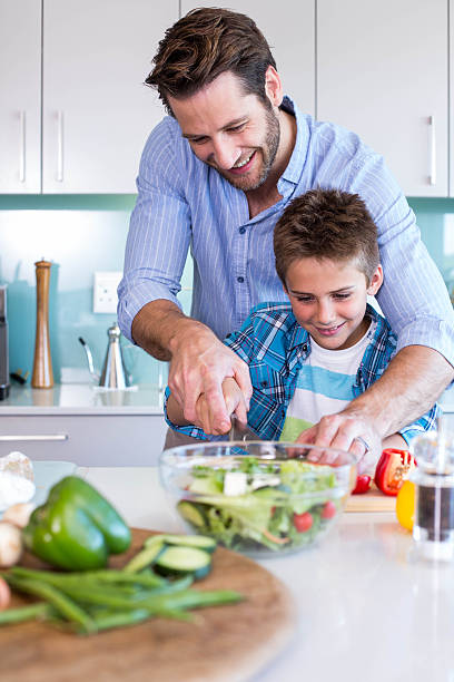 istock Happy family preparing vegetables together 479557358