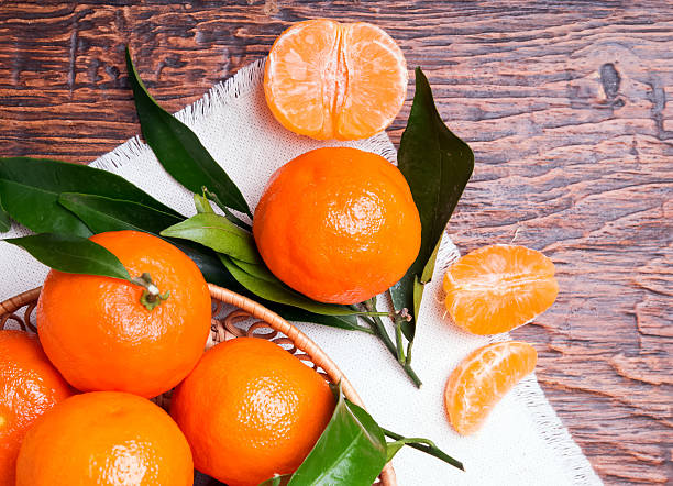 istock Tangerines on wooden table 479559829