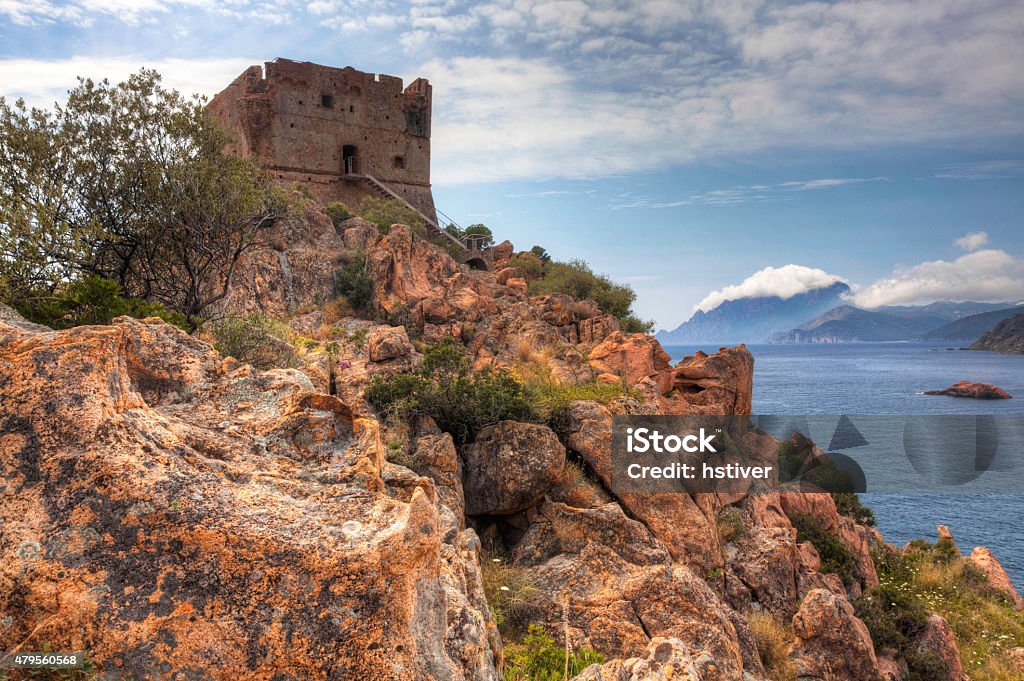 Colorful coastal view with a stone tower in Corsica, France A colorful coastal view with a stone tower in Corsica, France 2015 Stock Photo