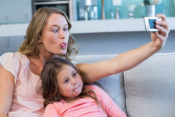 istock Happy mother and daughter taking selfie 479561444
