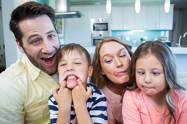 istock Happy family taking selfie on couch 479561452