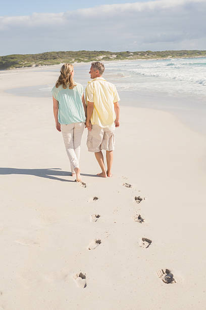 istock Happy couple walking holding hands 479561694