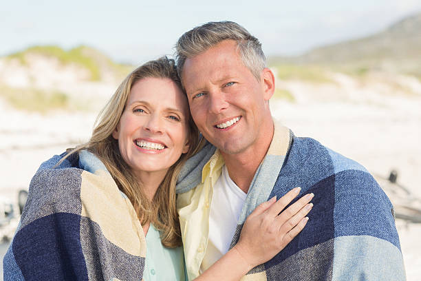 istock Happy couple wrapped up in blanket 479562548