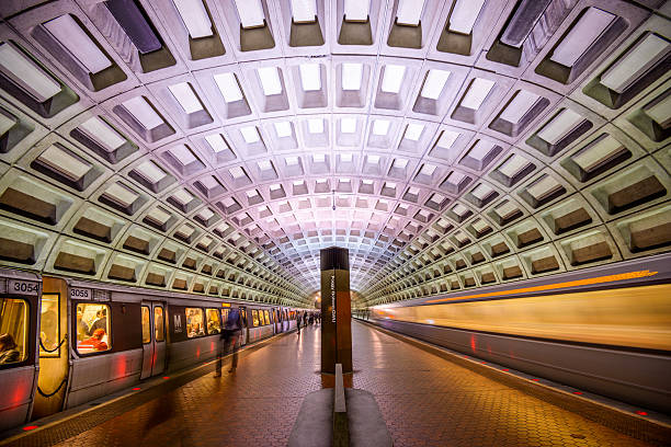 Metro in DC Washington DC, USA - April 10, 2015: Trains and passengers in the Foggy Bottom-GWU Metro Station. Opened in 1976, the Washington Metro is now the second-busiest rapid transit system in the U.S. rush hour photos stock pictures, royalty-free photos & images