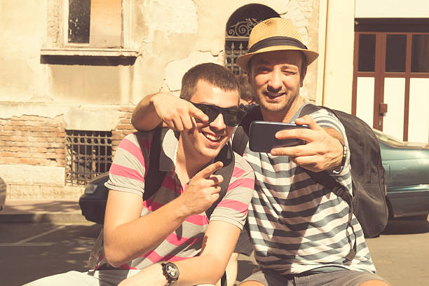istock Couple of guys doing a selfie. 479563120