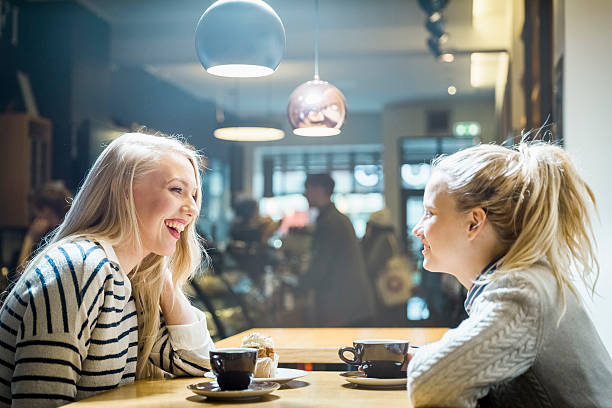 istock Happy women looking at each other in cafe 479565422