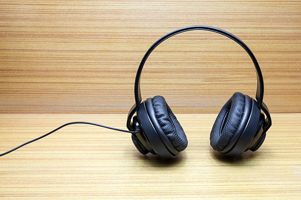 istock Headphones on wood background 479565654