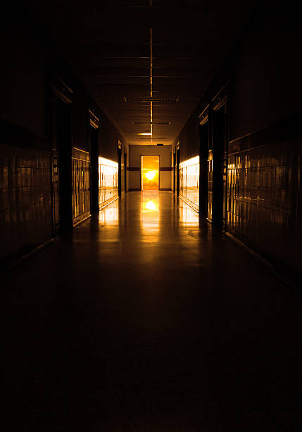 istock dark corridor to sun at the door 479566604