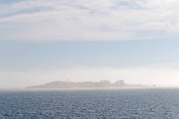 istock Island barly visible in the mist 479566778