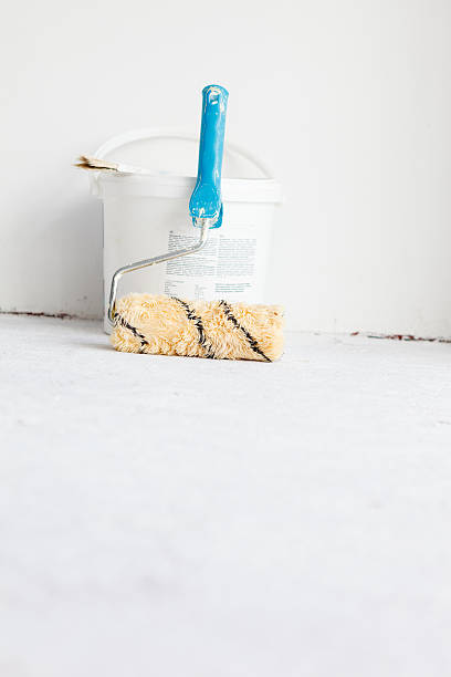 istock Paint bucket with roller brush on white. 479567070