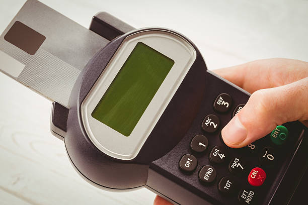 istock Man entering his pin on terminal 479567734
