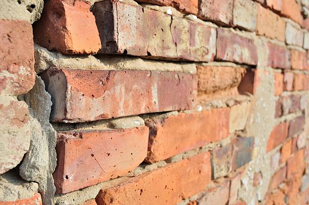 istock Detail of old brick wall in perspective 479568605