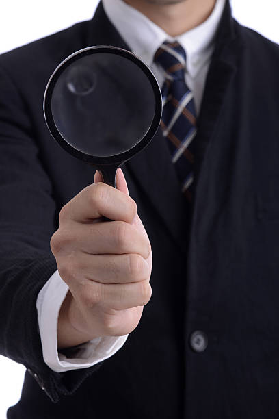 istock Magnifier Tool in Business Man Suit Holding Magnifying Glass 479568856