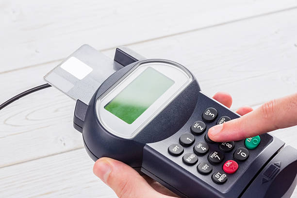 istock Man entering his pin on terminal 479572914