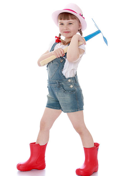 istock Baby boots shorts with a tool for processing vegetable garden 479574466