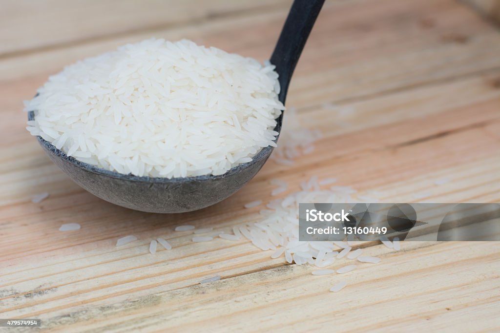 rice seeds Rice from Thailand , Placed on wood 2015 Stock Photo