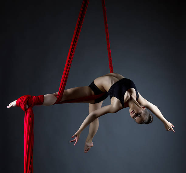 istock Image of elegant girl doing acrobatic trick 479575498