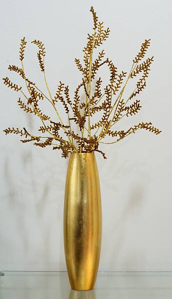 istock Gold vase with gold flower 479575999