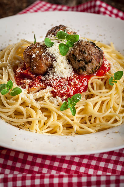 Pasta with tomato sauce ,meatballs  and grated parmesan
