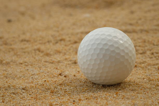 istock golf ball in sand trap - Stock image 479582462