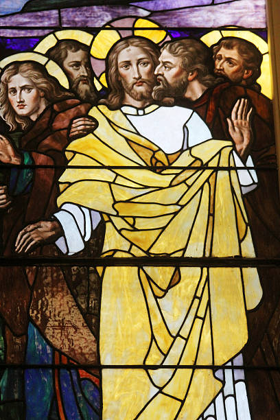 Stained Glass-The Kiss of Judas The betrayal of Jesus by Judas is depicted in this stained glass panel. judas stock pictures, royalty-free photos & images