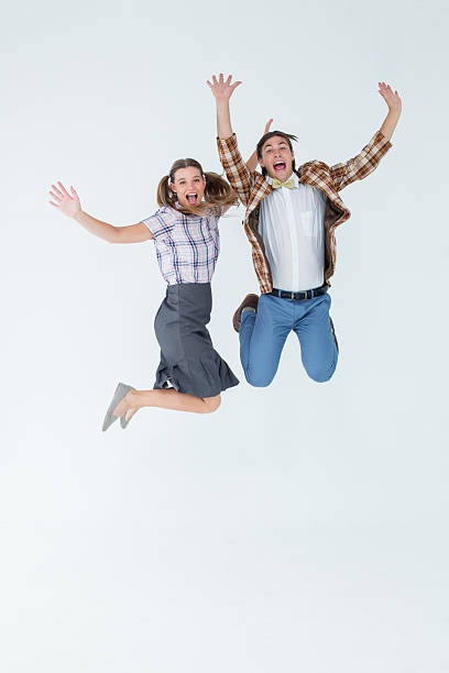 istock Geeky hipsters jumping and smiling 479585252
