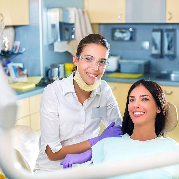 istock Young woman patient and dentist 479586380