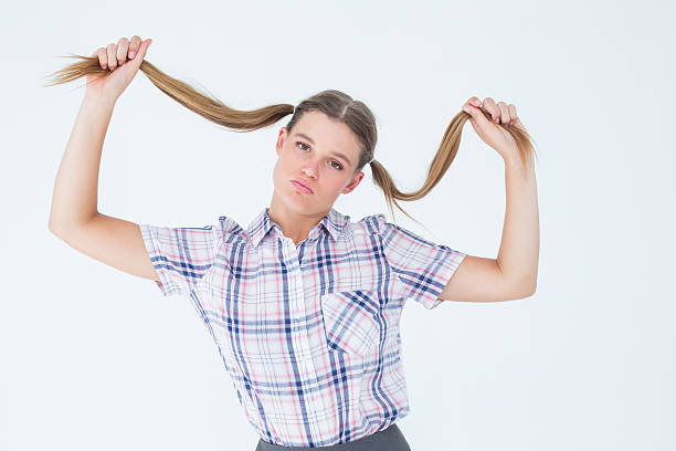 istock Geeky hipster holding her pigtails 479586442