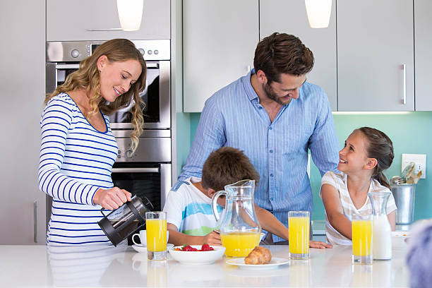 istock Happy family having breakfast together 479586796