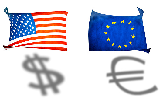 Flags of the United States and the European Union with appropriate currency signs on white background
